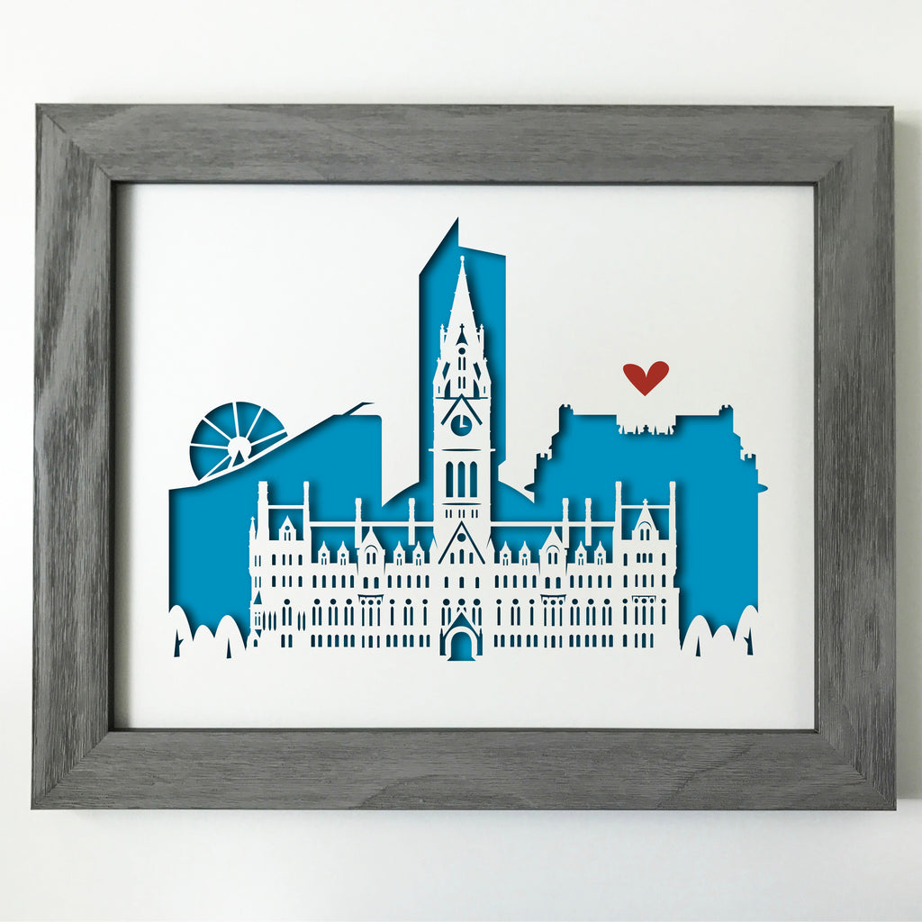 This cutout cityscape of Manchester highlights the Manchester Town Hall, with Urbis,the Beetham Tower, John Rylands Library, and the Wheel of Manchester.