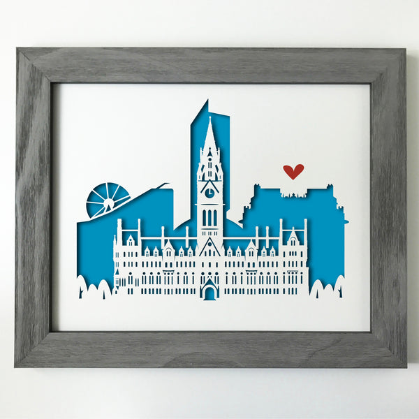 This cutout cityscape of Manchester highlights the Manchester Town Hall, with Urbis,the Beetham Tower, John Rylands Library, and the Wheel of Manchester. 